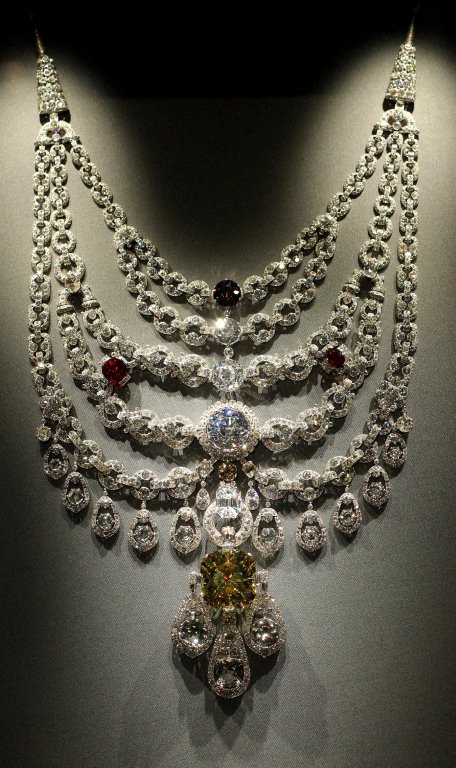 A Platinum, Diamond, Ruby and Topaz Cartier necklace from Paris dated 1928.jpg